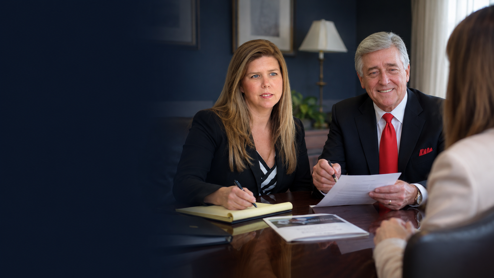 Attorneys with client at Stevens Law Firm